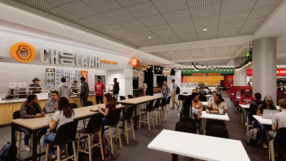 Busy cafeteria with people dining and ordering food at various counters under bright lighting. The Nebraska Union is set to add two new dining options — Sossy, a slow-cooked barbecue space, and Choolaah, the first Indian-inspired concept for the Nebraska Union. (rendering by Alley Poyner Macchietto Architecture)