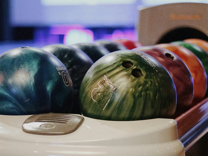 bowling balls in various colors. [unsplash]